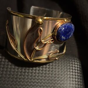 Elegant Silver and Gold Cuff Bracelet with Blue Stone
